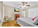 Cozy bedroom with hardwood floors, a fireplace, and a ceiling fan at 288 Valerie Cir, Hiram, GA 30141