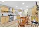 Well-lit kitchen featuring stainless steel appliances, stylish countertops, and wood-look vinyl flooring at 288 Valerie Cir, Hiram, GA 30141