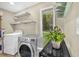 Laundry room with modern washer and dryer and an exterior view at 288 Valerie Cir, Hiram, GA 30141