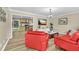 Comfortable living room with wood-look vinyl flooring and an open view into the updated kitchen at 288 Valerie Cir, Hiram, GA 30141