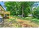 Scenic backyard with lush greenery, and a peaceful retreat with a storage shed at 4103 Laynewood Cir, Tucker, GA 30084