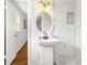 Bathroom features a tiled shower with marble-style tiling and a modern vanity at 4103 Laynewood Cir, Tucker, GA 30084