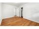 A comfortable bedroom with hardwood floors, neutral walls, and closet space at 4103 Laynewood Cir, Tucker, GA 30084