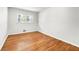 Minimalist bedroom featuring hardwood floors and a bright window at 4103 Laynewood Cir, Tucker, GA 30084