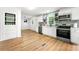 Modern kitchen with sleek countertops, stainless steel appliances, and white cabinetry at 4103 Laynewood Cir, Tucker, GA 30084