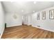 Large living room with wood floors, white walls, and a view into other rooms at 4103 Laynewood Cir, Tucker, GA 30084