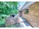 Brick patio area with barbecue grill offers a private outdoor space for entertainment and relaxation at 4581 Newcastle Cir, Lithonia, GA 30038