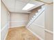 Unfinished basement with stairs and neutral colored walls ready for customization into a livable space at 4581 Newcastle Cir, Lithonia, GA 30038