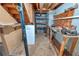 Unfinished basement with open rafters, tools and plenty of space for hobbies and storage at 4581 Newcastle Cir, Lithonia, GA 30038