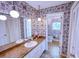 Retro bathroom featuring a double sink vanity and adjacent water closet at 4581 Newcastle Cir, Lithonia, GA 30038