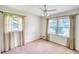 Bright bedroom featuring two windows that allow for plenty of natural light and ceiling fan at 4581 Newcastle Cir, Lithonia, GA 30038