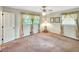 Bedroom featuring a ceiling fan, a window with curtains and neutral walls and carpeting at 4581 Newcastle Cir, Lithonia, GA 30038