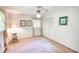 A cozy bedroom featuring a ceiling fan, closet and bright natural light with unique decor at 4581 Newcastle Cir, Lithonia, GA 30038