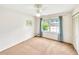 A clean and simple bedroom with a ceiling fan, window, and closet at 4581 Newcastle Cir, Lithonia, GA 30038