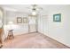 Cozy bedroom with neutral walls, ceiling fan, and an ample-sized closet at 4581 Newcastle Cir, Lithonia, GA 30038