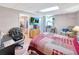 Bedroom featuring wood floor, closet, work space, natural light and a television for entertainment at 4581 Newcastle Cir, Lithonia, GA 30038