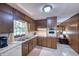 Traditional kitchen with wooden cabinets and essential appliances, offering a functional cooking space at 4581 Newcastle Cir, Lithonia, GA 30038