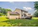 Spacious backyard with a wooden deck and well-maintained lawn, perfect for outdoor activities at 5867 Heritage Walk, Lithonia, GA 30058