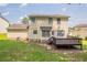 Large backyard with a wooden deck and well-maintained lawn, perfect for outdoor activities at 5867 Heritage Walk, Lithonia, GA 30058
