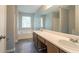 Bright bathroom featuring double sinks, a soaking tub, and a large mirror for a luxurious feel at 5867 Heritage Walk, Lithonia, GA 30058