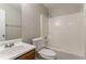 Bathroom featuring a shower, sink, and toilet, designed for functionality and comfort at 5867 Heritage Walk, Lithonia, GA 30058