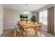 Inviting dining room with modern lighting, stylish decor, and ample space for entertaining at 5867 Heritage Walk, Lithonia, GA 30058