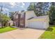 Lovely two-story home featuring brick accents and an attached two-car garage for added convenience at 5867 Heritage Walk, Lithonia, GA 30058
