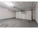 Spacious garage featuring an automatic door opener and concrete floors at 5867 Heritage Walk, Lithonia, GA 30058