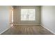 Inviting living room with plush carpeting and a large window providing ample natural light at 5867 Heritage Walk, Lithonia, GA 30058