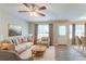 Bright living room featuring neutral decor, hardwood floors, and a cozy seating area at 5867 Heritage Walk, Lithonia, GA 30058