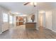 Open-concept living area seamlessly connects to the kitchen, featuring hardwood floors and lots of natural light at 5867 Heritage Walk, Lithonia, GA 30058