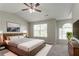 Spacious main bedroom with plush carpeting, a large bed, and a serene ambiance at 5867 Heritage Walk, Lithonia, GA 30058