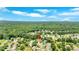Aerial view of a neighborhood with mature trees, with the property indicated by a pin at 1002 Hallman Sw Ter, Marietta, GA 30064