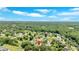 Aerial view of a neighborhood with mature trees, with the property indicated by a pin at 1002 Hallman Sw Ter, Marietta, GA 30064