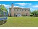 Expansive backyard featuring lush lawn, mature trees, a trampoline, and a well-maintained exterior at 1002 Hallman Sw Ter, Marietta, GA 30064