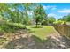 Enjoy this backyard featuring mature trees, greenery, and ample space for outdoor enjoyment at 1002 Hallman Sw Ter, Marietta, GA 30064