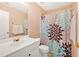 Neutral bathroom with a large mirror, a vanity with a white countertop, and a toilet at 1002 Hallman Sw Ter, Marietta, GA 30064