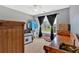 Bright bedroom featuring natural light, a ceiling fan, and a view of the outdoors at 1002 Hallman Sw Ter, Marietta, GA 30064