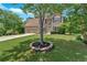 Beautiful home with lush green lawn, mature landscaping, and a spacious driveway at 1002 Hallman Sw Ter, Marietta, GA 30064