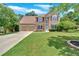 Charming two-story home with a well-manicured lawn, mature trees, and a two-car garage at 1002 Hallman Sw Ter, Marietta, GA 30064