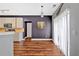 Open kitchen-dining space with wood floors, natural light, and stainless appliances at 1002 Hallman Sw Ter, Marietta, GA 30064
