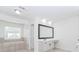Bathroom featuring a bathtub, large vanity, and plenty of natural light at 2023 Jameson Cir, Lawrenceville, GA 30043