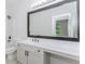 Bathroom featuring a bright vanity, large mirror and shower/tub combo at 2023 Jameson Cir, Lawrenceville, GA 30043