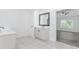Bright bathroom featuring double sink vanity, modern fixtures, and tile flooring at 2023 Jameson Cir, Lawrenceville, GA 30043