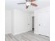 Bedroom featuring a ceiling fan, hardwood floors, and white trim at 2023 Jameson Cir, Lawrenceville, GA 30043