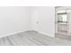Bedroom featuring gray wood flooring, an interior door, and an ensuite bathroom at 2023 Jameson Cir, Lawrenceville, GA 30043