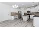 Modern kitchen with white cabinets, stainless steel appliances, and a center island, perfect for meal preparation at 2023 Jameson Cir, Lawrenceville, GA 30043