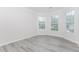 Office room featuring gray wood flooring and natural light from two windows at 2023 Jameson Cir, Lawrenceville, GA 30043