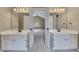 Dual sink bathroom with neutral paint, modern fixtures and a joining bedroom at 2031 Greyfield Nw Dr, Kennesaw, GA 30152