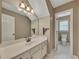 Bathroom features include a vanity, large mirror, and toilet in adjacent room at 2031 Greyfield Nw Dr, Kennesaw, GA 30152
